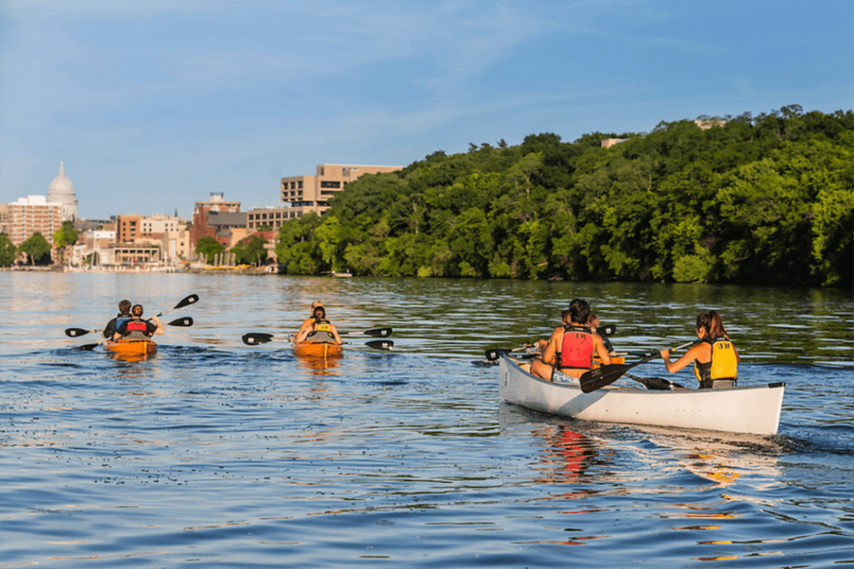 People riding kayaks on the lake