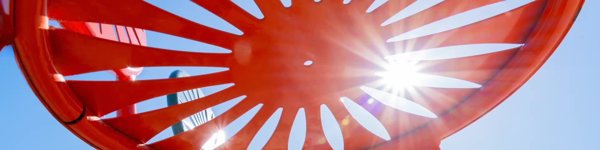 Close-up shot of an orange Terrace chair seat with the sun shining through