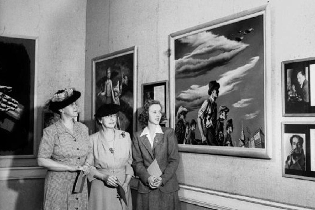 Union History: Three women standing in front of hanging art