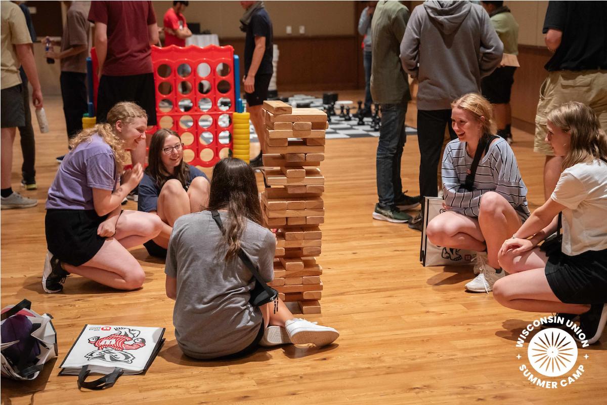 Kids playing a game of oversized Jenga