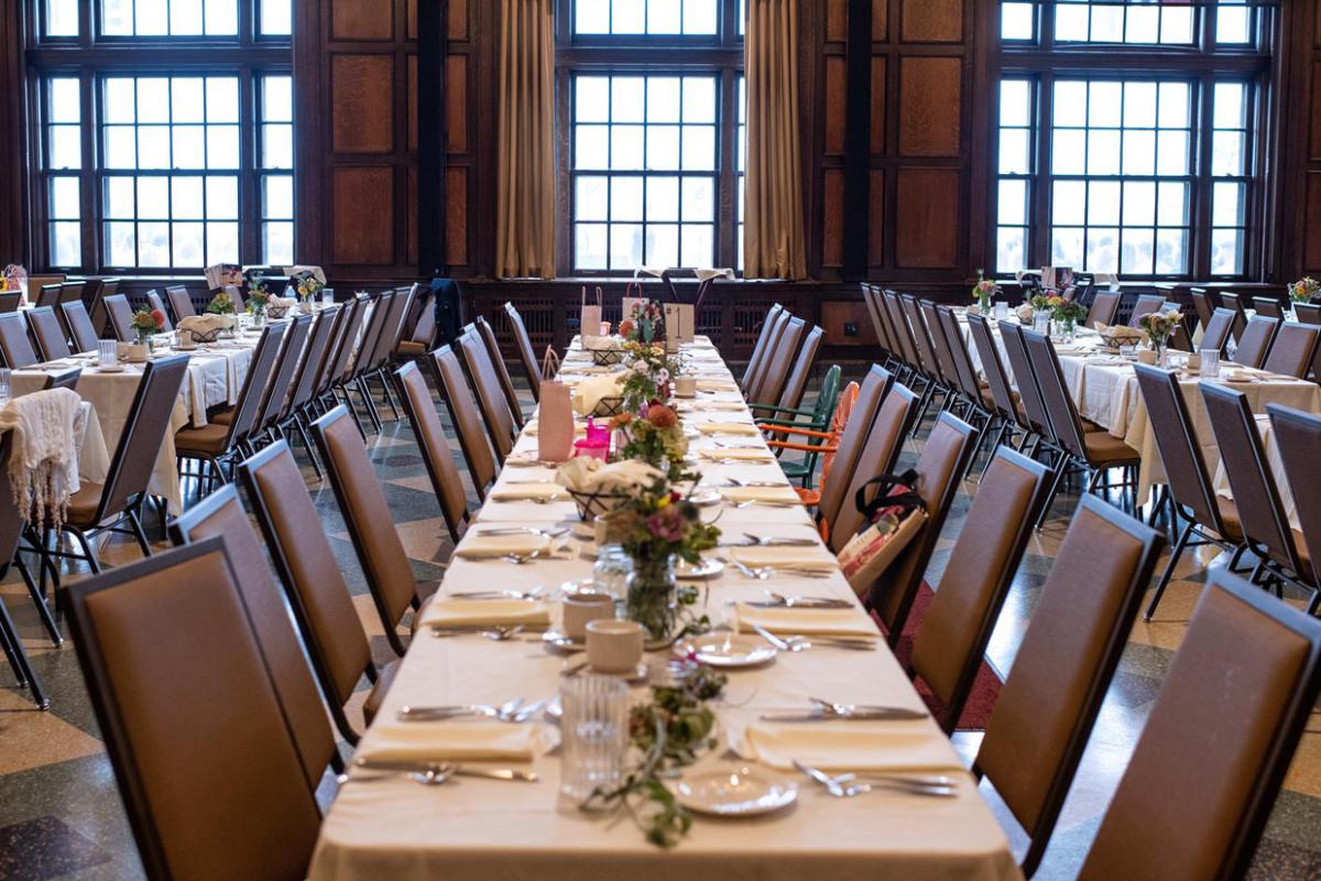 Rows of tables set up for a wedding banquet