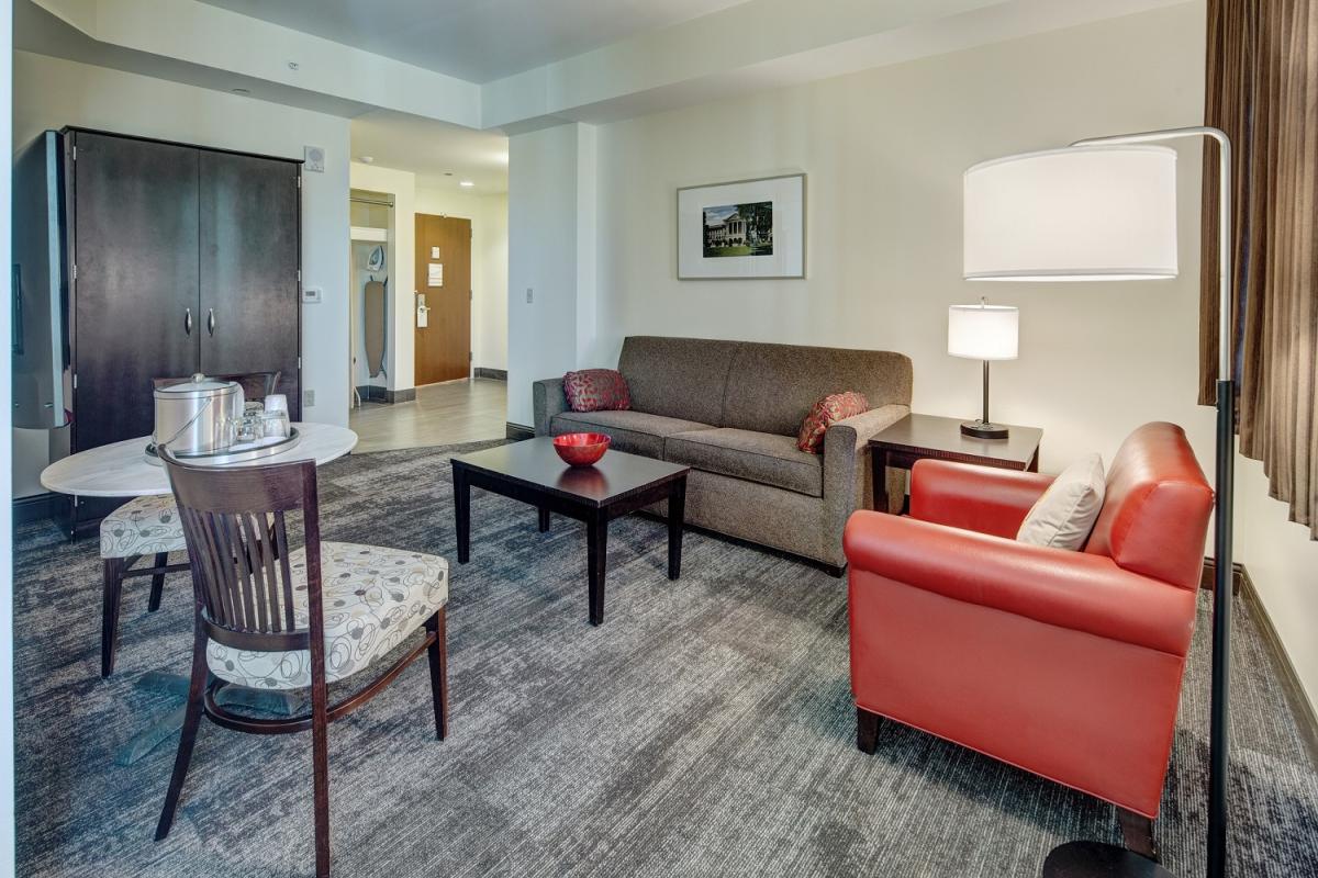 Union South Hotel extended stay suite amenities: living area with sofa and kitchenette
