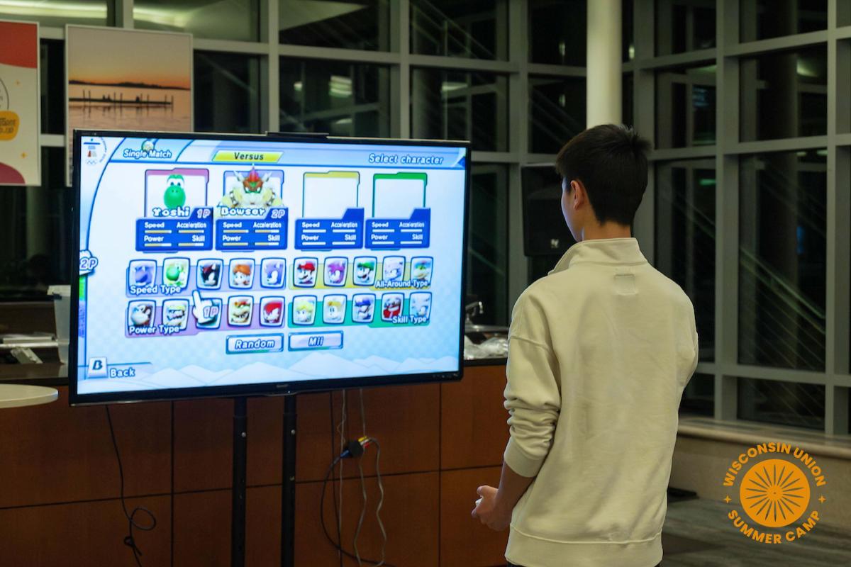 Someone playing a Mario Nintendo video game during the Winter Olympic Games