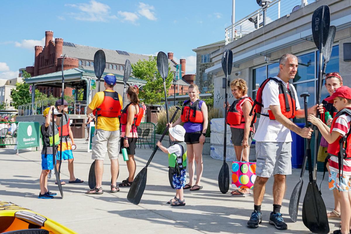 Families preparing to paddle on the lake