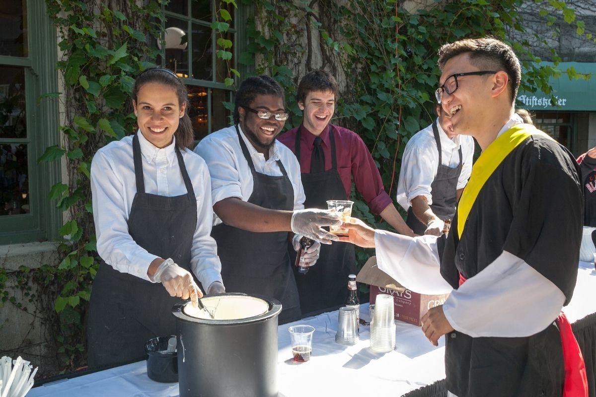 Someone receives a rootbeer float at a catered event on the Terrace