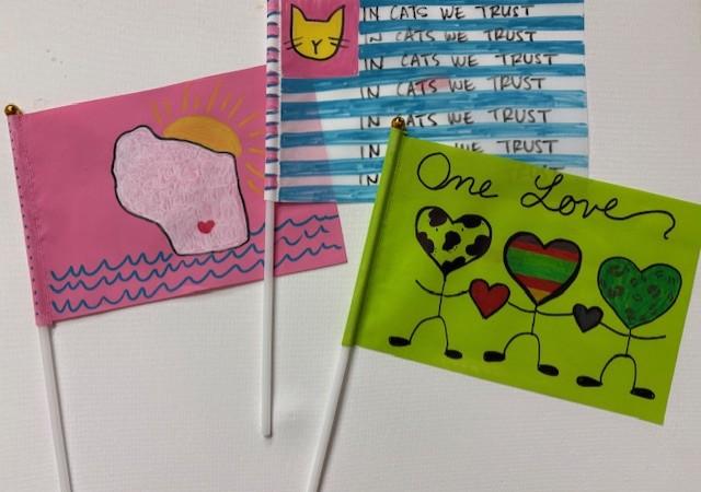 Three hand decorated flags.