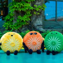 three Terrace chairlings in yellow, orange adn green sitting on green Terracetable with greenery and window behind them